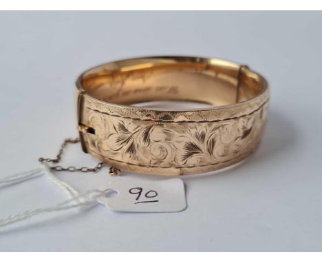 A rolled gold bangle (small dent)