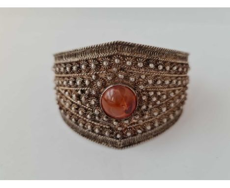 A silver antique cuff bangle set with a cornelian marked 95 s 
