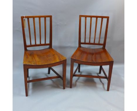 A pair of 19th century mahogany stick back dining chairs raised on square tapered legs and joined by stretchers 