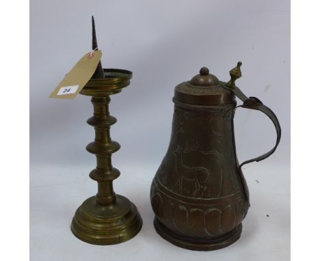A 19th century copper flagon and 18th century pricket candlestick  