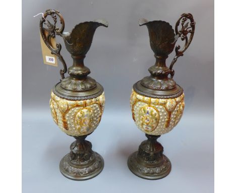 A pair of Continental ceramic and spelter ewers in the classical taste H 53cm 