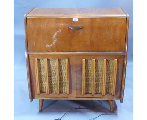 A vintage record player raised on tapered supports H 82cm 