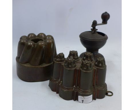 Two antique jelly moulds and 19th century coffee grinder 