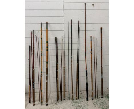 A large quantity of complete and incomplete vintage fishing rods, approx eleven in total, various lengths and makers to inclu