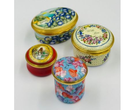A selection of four Halcyon Days collectable enamel pill boxes 