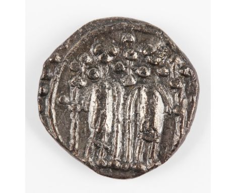 An early Anglo-Saxon period sceatta, secondary phase, series N, obverse with two standing figures facing, holding crosses, re