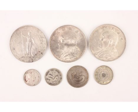 A small collection of Chinese and Japanese silver coinage, including two China Yuan Shih-kai dollars 1914, a Trade dollar 190