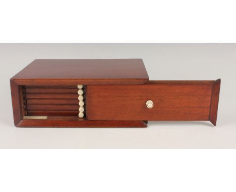 A mahogany coin collector's box, the sliding front revealing six trays with ivory handles, height 8cm, width 21cm. Note: a no