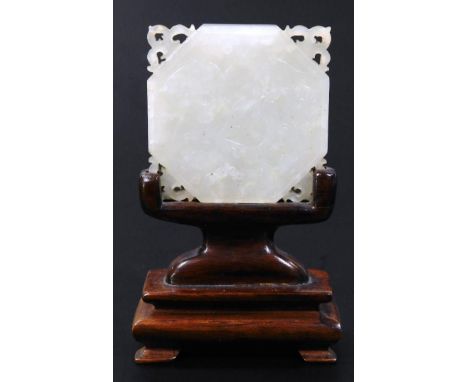 A miniature white jade table screen, of shaped outline on wooden base, 8cm high. 