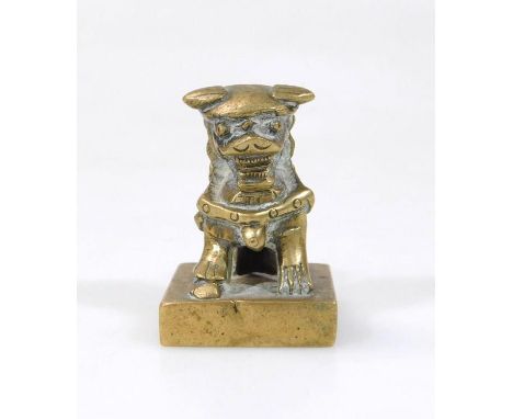 A Chinese metal Dog of Fo desk seal, on a square plinth base, marked beneath, 5cm high.