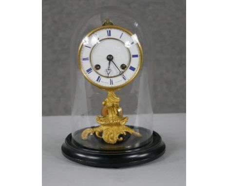 A 19th century French gilt metal ormolu foliate and floral design mantle clock with glass and ebonised display dome. White en