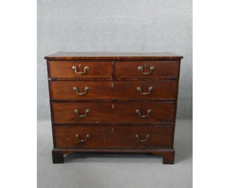 A Georgian mahogany chest with brass swan neck handles on shaped bracket feet. H.90 W.103 D.50cm 