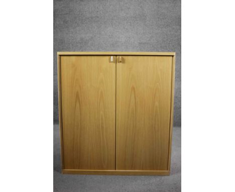 A contemporary light oak Musterring cabinet. H.100 W.90 D.45 cm. 