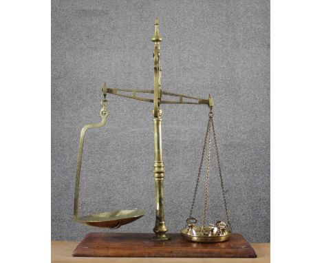 A set of large Victorian Parnall &amp; Sons of Bristol brass and oak shop scales with weights. Impressed makers mark. H.90 W.