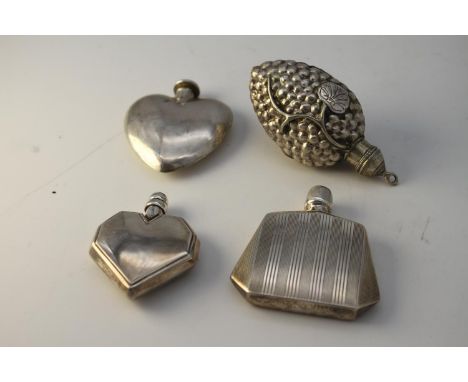 Four perfume bottles. A Danish silver heart shaped scent bottle with engraved design, stamped C.Mich, 830S, a silver plated g