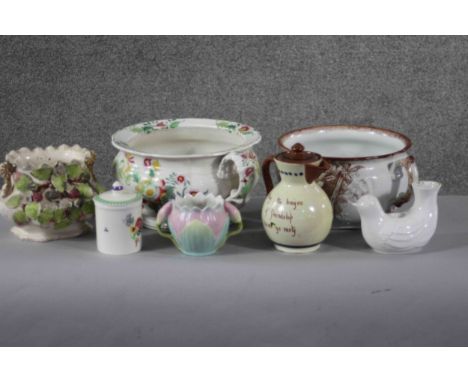 A collection of seven porcelain and ceramic pieces. Including a Torquay ware lidded jug, two Victorian hand painted chamber p