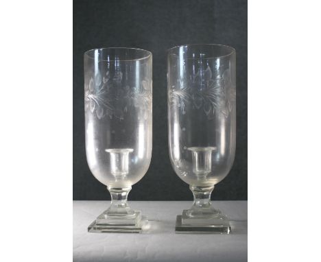 Two large Victorian foliate and floral engraved glass storm lantern candle holders. H.38 Diam. 15 cm 