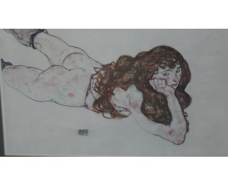 A framed and glazed print of Female nude lying on her stomach by Egon Schiele. H.45 W.60cm 