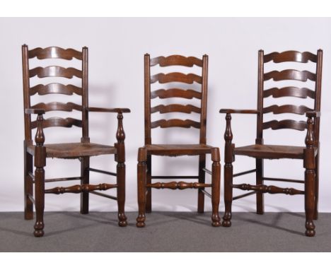 Six ash ladder back chairs, rush seats, turned legs. 