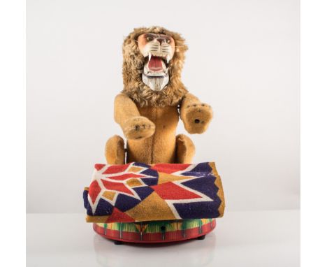 Japanese plush lion sitting on a tin plate drum complete with blanket, battery operated and a Steiff Poodle 12cm x 13cm with 