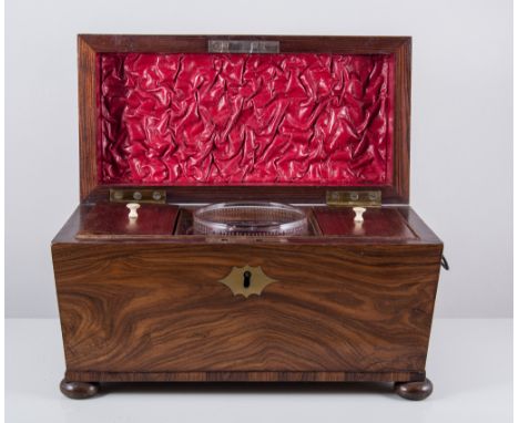 Victorian walnut tea caddy, sarcophagus form on four ball feet containing a mixing bowl and two lidded compartments, ring han