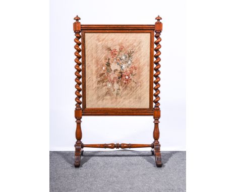 Mahogany fire screen with barley twist supports and tapestry inset, 50cm x 43cm, overall dimensions 95cm x 60cm.