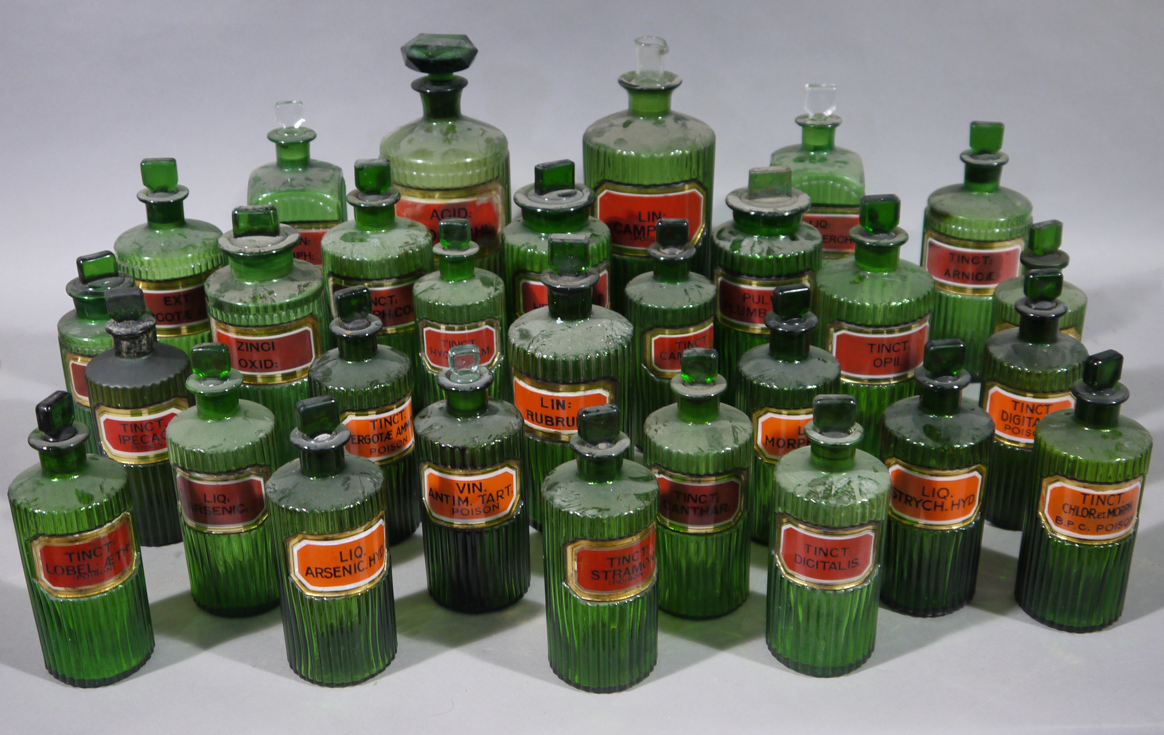 A set of twentynine late 19th/early 20th century green ribbed glass