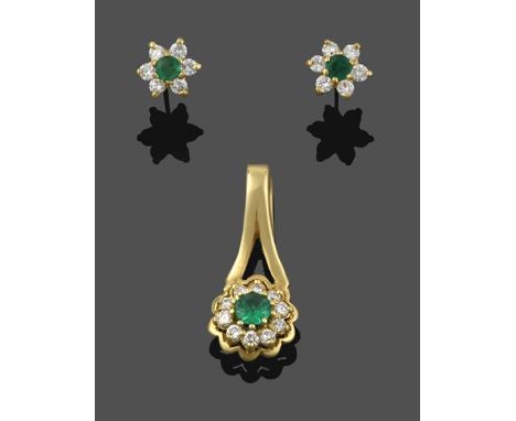 An Emerald and Diamond Cluster Pendant, the round cut emerald within a border of round brilliant cut diamonds in yellow claw 