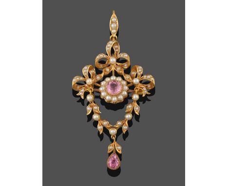 An Edwardian Seed Pearl and Pink Tourmaline Brooch/Pendant, a round cut pink tourmaline in a yellow millegrain setting, withi