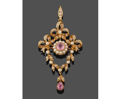 An Edwardian Seed Pearl and Pink Tourmaline Brooch/Pendant, a round cut pink tourmaline in a yellow millegrain setting, withi