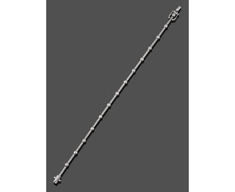 A Diamond Line Bracelet, bar links set with five round brilliant cut diamonds in white claw and channel settings alternate wi