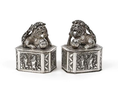 A Pair of Chinese Silver Boxes, by Chang Yuan, 20th Century, each elongated octagonal, the sides chased with figures in lands