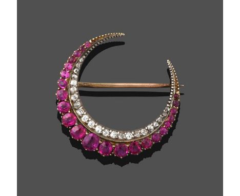 A Ruby and Diamond Crescent Brooch, formed of two rows, one of graduated round cut and oval cut rubies in yellow collet setti