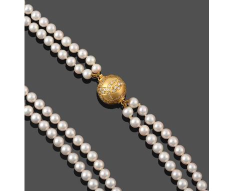A Two Strand Cultured Pearl Necklace, the 91:97 uniform cultured pearls knotted to a yellow spherical clasp set throughout wi