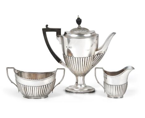 A Three-Piece Edward VII Silver Coffee-Service, by William Hutton and Sons, London, 1904 and 1908, each piece part-fluted tap