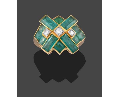 An Emerald and Diamond Ring, of geometric design, three round brilliant cut diamonds in white millegrain settings, within a b