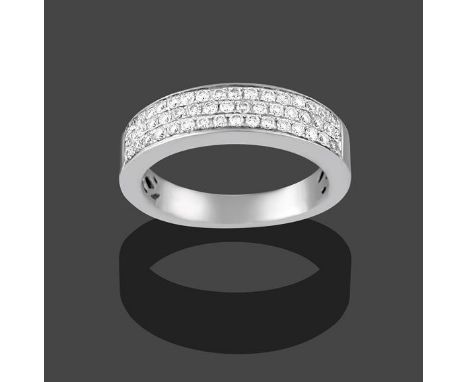 An 18 Carat White Gold Diamond Half Hoop Ring, three rows of eight-cut diamonds in claw settings, to a plain polished shank, 