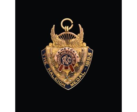 A Victorian Gold and Enamel Medal, by Vaughton and Sons, Birmingham, 1893, 9ct, shield shaped, the outer edge enamelled in bl