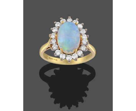 An 18 Carat Gold Opal and Diamond Cluster Ring, the oval cabochon opal in yellow claw settings, within a border of eight-cut 