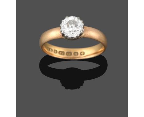 A 22 Carat Gold Diamond Solitaire Ring, the old cut diamond in a white claw setting, on a yellow plain polished shank, estima