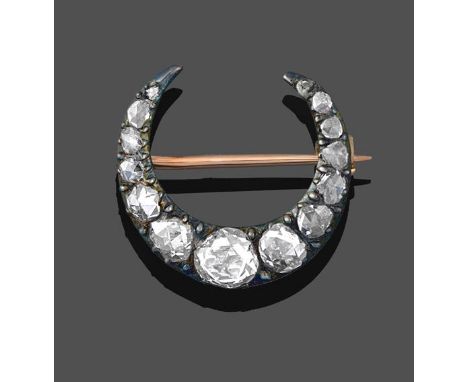 A Diamond Crescent Brooch, set throughout with rose cut diamonds in claw and collet settings, total estimated diamond weight 