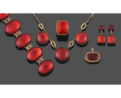 A Red Chinese Amber Necklace, formed of three round cabochon red ambers in yellow rubbed over settings with a rope detail bor