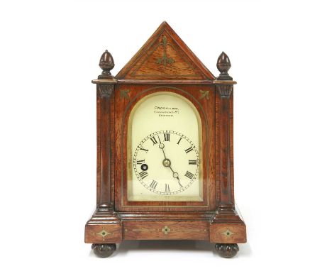 A rosewood Gothic Revival bracket clock, early 19th century, by John Frodsham, the white arched dial inscribed 'Frodsham Grac