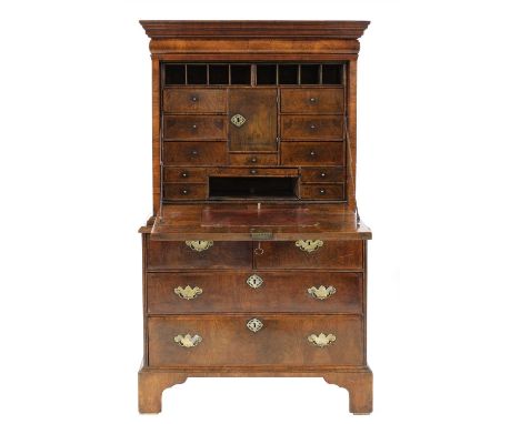 A walnut and featherbanded escritoire, mid-18th century and later, of small proportions, with a cushion frieze drawer, a drop