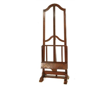 An adjustable easel, early 20th century, with scumbled finish and rachet system, 76cm wide 216cm high