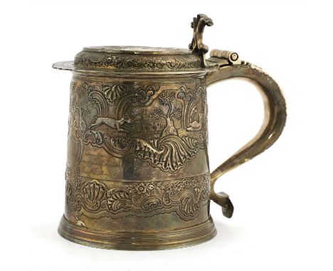 A William and Mary silver tankard, by Timothy Ley, mark entered 1697, with flat top, later embossed hunting decoration and fo