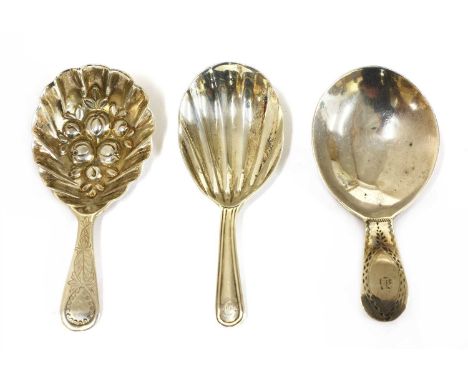 A George III silver caddy spoon , London 1802, marked IB, with fruit moulded bowl, together with a second, Thomas Wallis II, 