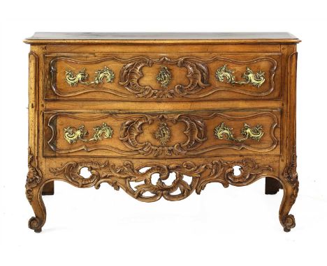 A Continental walnut serpentine commode, 18th century, with foliate carved detail and raised on scrolling cabriole supports, 