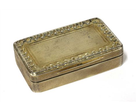 A George III silver gilt snuff box , by 'ILWA', London 1812, of rectangular form, with engine turned decoration, the hinged l