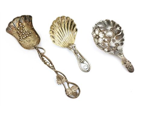 A Victorian silver caddy spoon , Aaron Hadfield, Sheffield 1847 , the bowl ornately cast with foliage and flowers, another, G